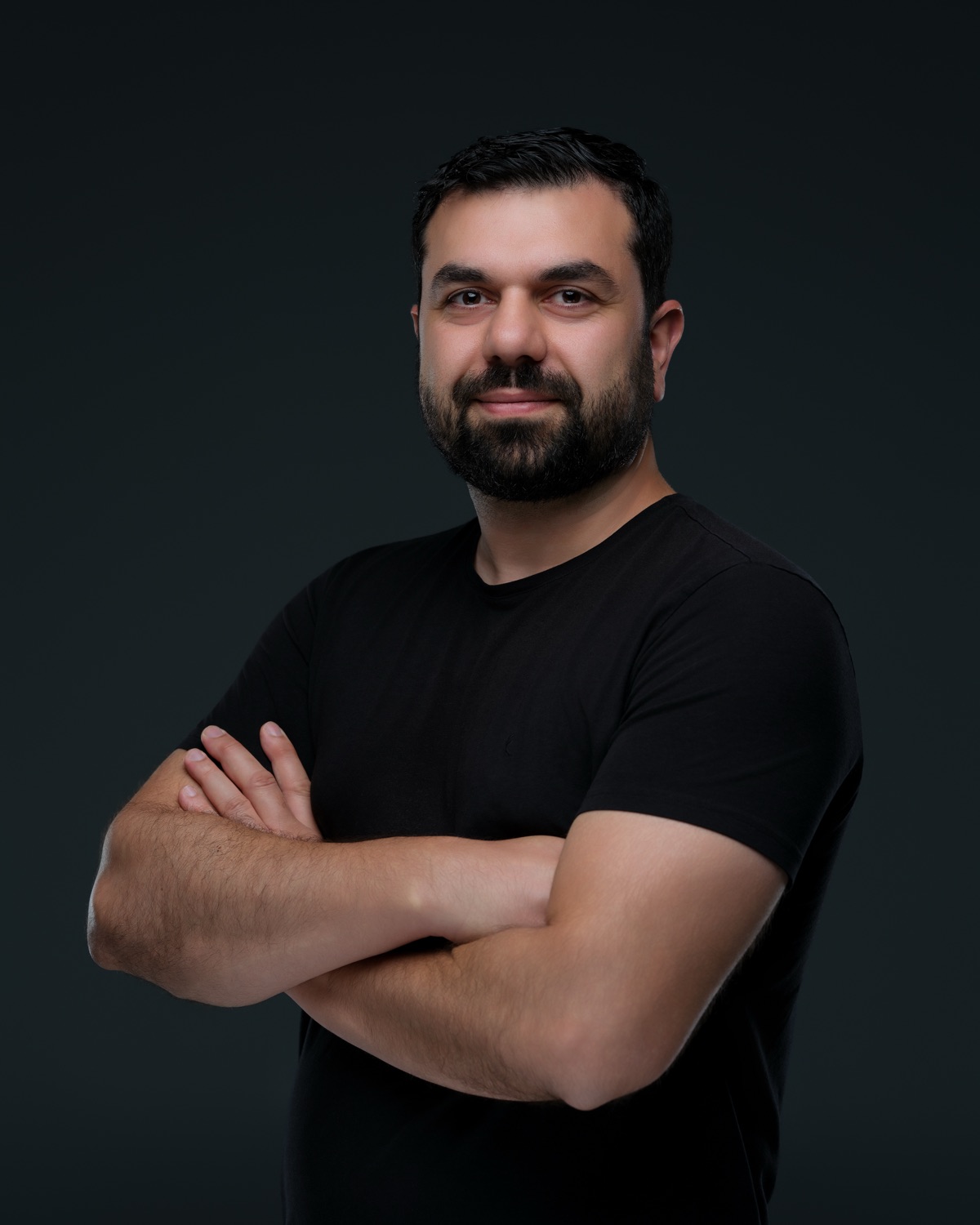 Professional headshot of Aziz Aghayev, keynote speaker and AI trainer